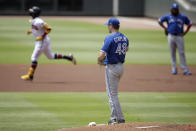 Toronto Blue Jays pitcher Ross Stripling (48) waits for Atlanta Braves' Ronald Acuna Jr., left, to run the bases after giving up a home run in the first inning of a baseball game Thursday, May 13, 2021, in Atlanta. (AP Photo/Ben Margot)