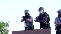 Police aim at a Reuters TV cameraman during nationwide unrest following the death of of George Floyd in Minneapolis police custody, in Minneapolis