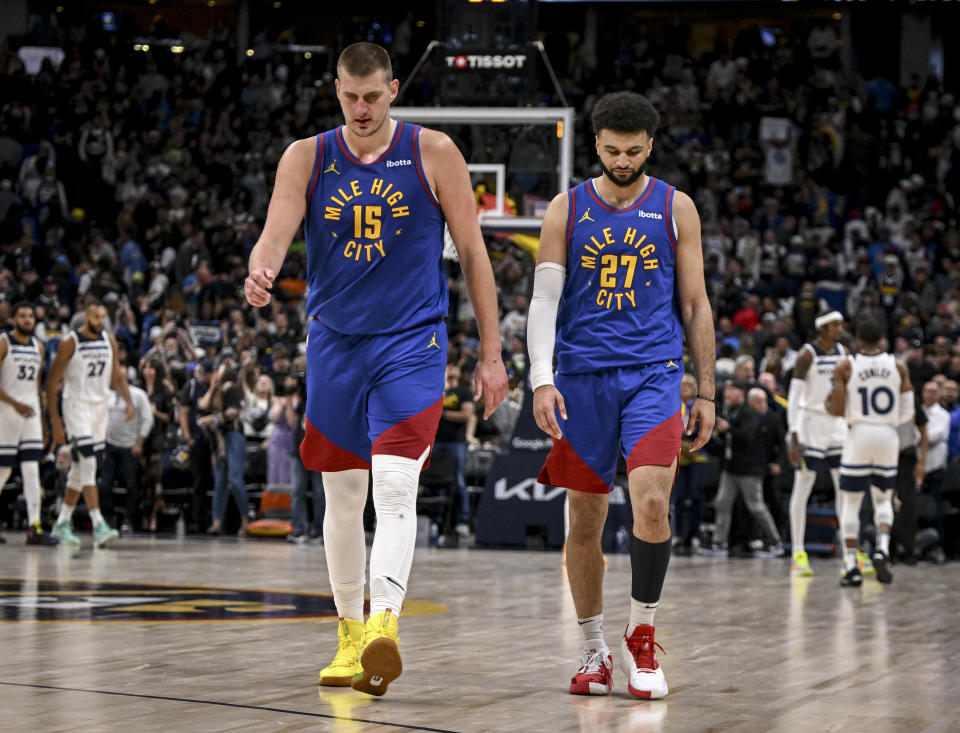 DENVER, CO - MAY 4: Nikola Jokic (15) and Jamal Murray (27) of the Denver Nuggets walk off the court after the fourth quarter of the Minnesota Timberwolves' 106-99 win at Ball Arena in Denver on Saturday, May 4, 2024. (Photo by AAron Ontiveroz/The Denver Post)