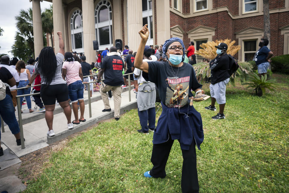 A woman shouts during a rally at the Glynn County Courthouse to protest the shooting of Ahmaud Arbery, Saturday, May 16, 2020, in Brunswick, Ga. (AP Photo/Stephen B. Morton)