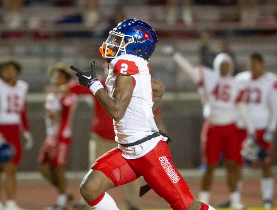 Cooper's Daniel Bray runs for a touchdown against El Paso Chapin in the Region I-5A Division II bi-district playoff game Friday at Austin High School in El Paso.