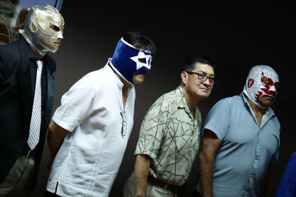 Mexican professional wrestlers attend a news conference announcing inductions into the Juárez Lucha Libre Hall of Fame.