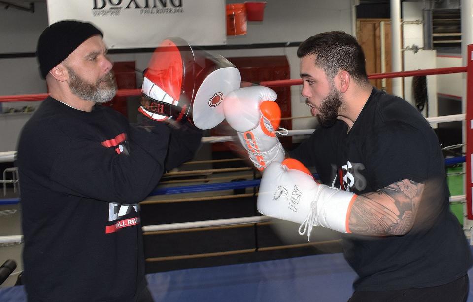 Josh Parker trains with coach Mike Bryant at Love's Boxing at 126 Shove St. in Fall River Tuesday, Jan. 1 2024.