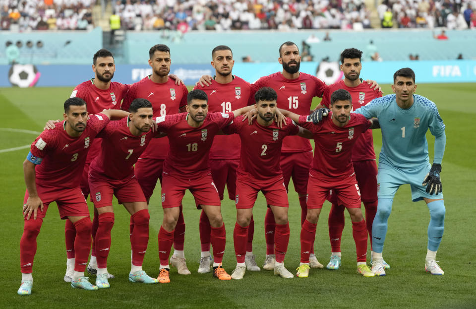 Iranian players pose ahead of the World Cup group B soccer match between England and Iran at the Khalifa International Stadium in Doha, Qatar, Monday, Nov. 21, 2022. (AP Photo/Frank Augstein)