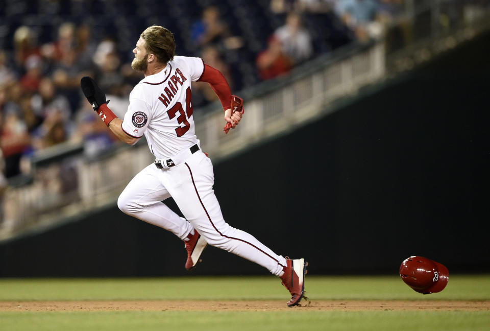 Washington Nationals' Bryce Harper runs to third on a double by Juan Soto during the eighth inning of a baseball game against the Chicago Cubs, Thursday, Sept. 6, 2018, in Washington. The Cubs won 6-4 in 10 innings. (AP Photo/Nick Wass)