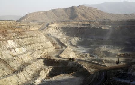 Trucks ferry excavated gold, copper and zinc ore from the main mining pit at the Bisha Mining Share Company (BMSC) in Eritrea, operated by Canadian company Nevsun Resources, February 17, 2016. REUTERS/Thomas Mukoya/File Photo