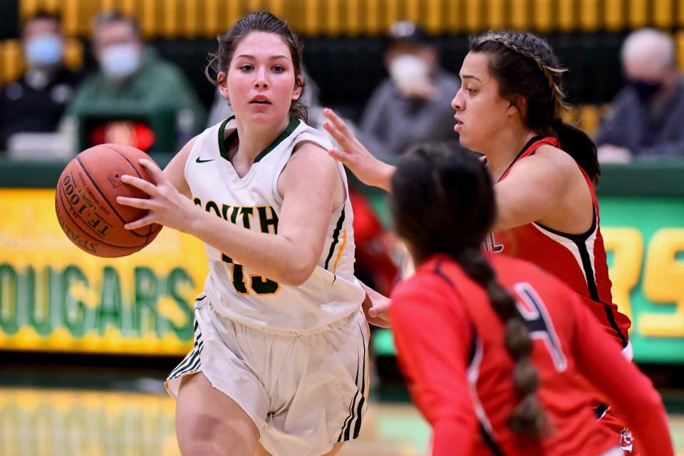 Salina South guard Sydney Anderes (15) is double-teamed by Liberal's Lizzy Cisnersos (4) and Hailey Contreras Thursday night in a first-round Salina Invitational Tournament game at the South gym.