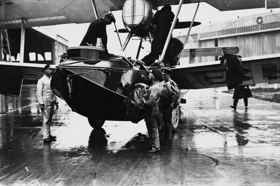 RAF Squadron Leader Archibald Stuart-MacLaren in the cockpit (top, left) of his Vickers Vulture amphibious biplane at Calshot aerodrome, Hampshire, 25th March 1924. Stuart-MacLaren, along with Flying Officer William Plenderleith and Sergeant W. H. Andrews are about to attempt a round-the-world flight. The airmen made it as far as the Bering Sea, where they were forced to ditch on 4th August 1924. (Photo by Brooke/Topical Press Agency/Hulton Archive/Getty Images)
