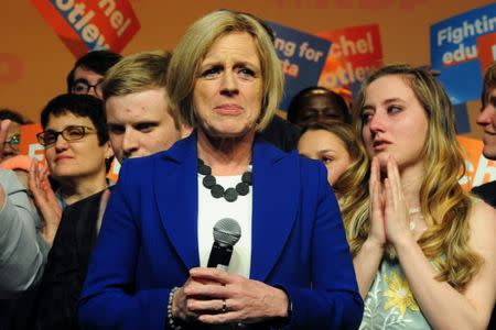 Alberta New Democratic (NDP) leader and Premier Rachel Notley, flanked by her son Ethan and daughter Sophie, reacts to her loss at her election night party in Edmonton, Alberta, Canada, April, 16, 2019. REUTERS/Candace Elliott