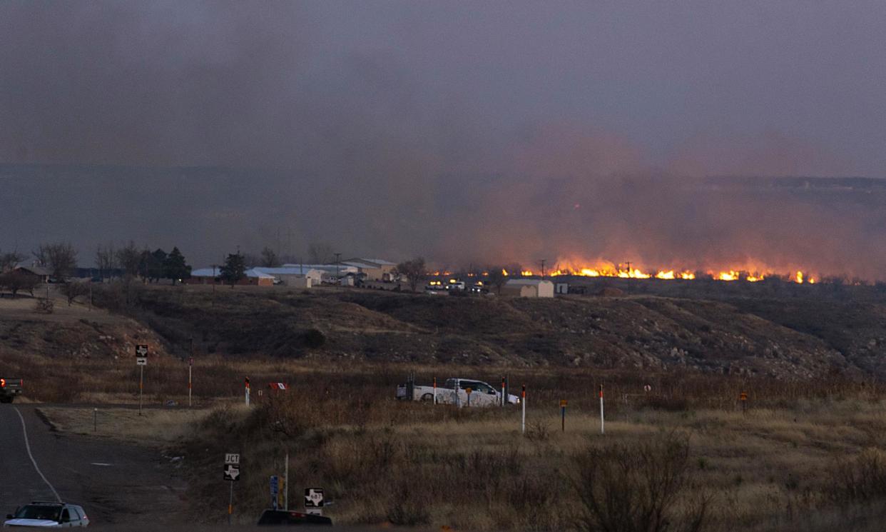 <span>Firefighters battle flames from the Smokehouse Creek fire on Sunday near Sanford, Texas. An evacuation order was issued for the town’s residents.</span><span>Photograph: Scott Olson/Getty Images</span>