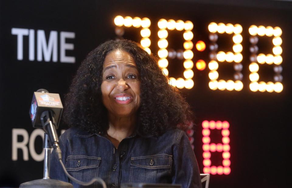 Melanie Mills, the wife of the late Sam Mills Jr., speak to the media at the Pro Football Hall of Fame in Canton on Monday, March 14, 2022. Sam Mills Jr. is a member of the Class of 2022.