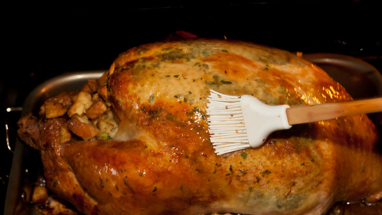 basting turkey with brush