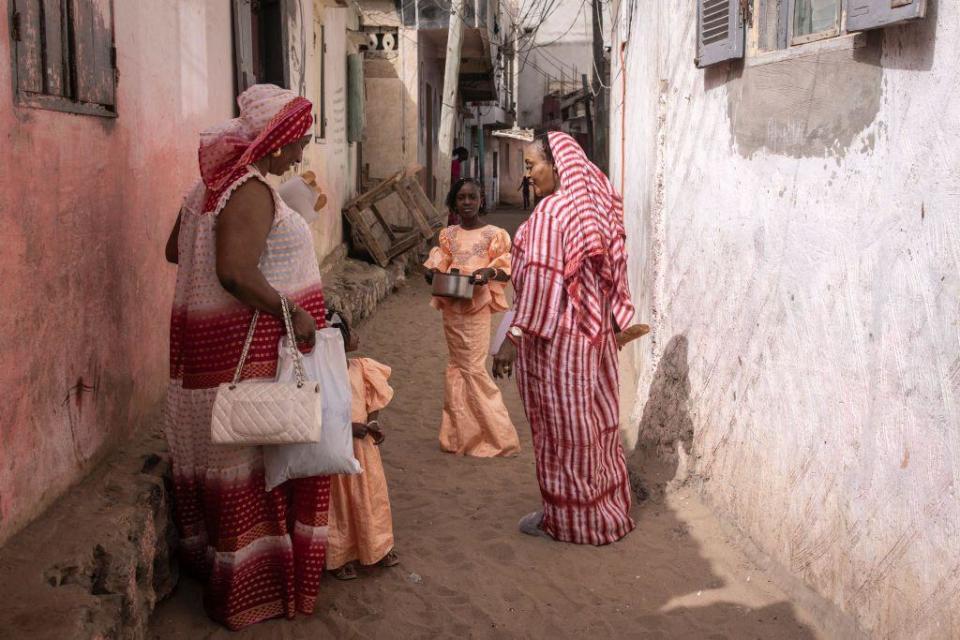 Women dressed in traditional attire gather during Tabaski (Eid al-Adha) celebrations in Dakar on June 17, 2024.