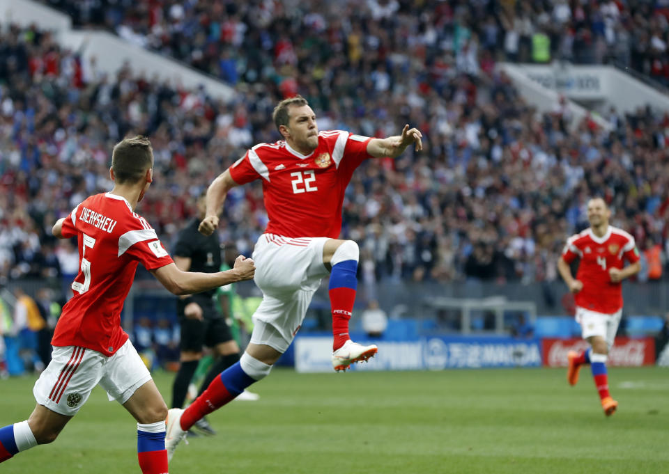 <p>Russia’s Artyom Dzyuba, center, celebrates after scoring his side’s third goal during the group A match between Russia and Saudi Arabia which opens the 2018 soccer World Cup at the Luzhniki stadium in Moscow, Russia, Thursday, June 14, 2018. (AP Photo/Pavel Golovkin) </p>