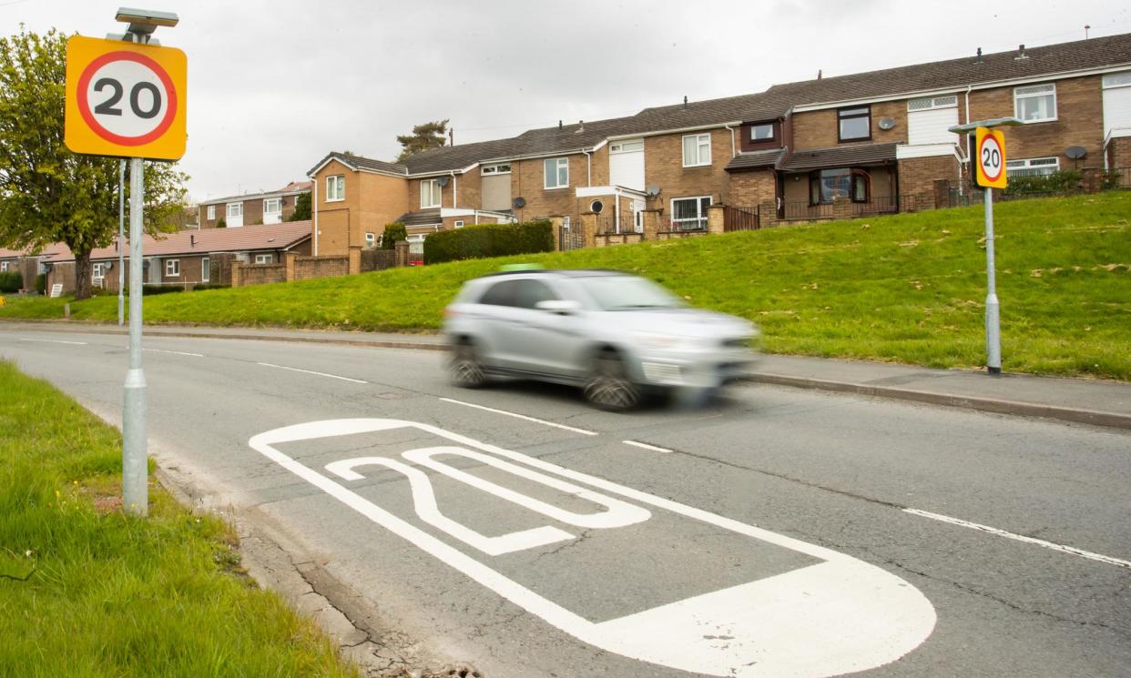 <span>A 20mph speed limit sign. Residents in Rhayader express mixed feelings about a possible return to a 30mph limit.</span><span>Photograph: Kara Thomas/Athena Pictures</span>