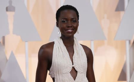 Actress Lupita Nyong'o wears a Calvin Klein gown and Chopard diamonds as she arrives at the 87th Academy Awards in Hollywood, California in this February 22, 2015 file photo. REUTERS/Mario Anzuoni/Files