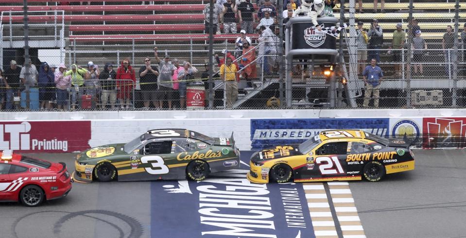 Austin Dillon (3) leads Daniel Hemric to the checkered flag behind the pace car while under caution during the NASCAR Xfinity series auto race, Saturday, June 9, 2018, in Brooklyn, Mich. (AP Photo/Carlos Osorio)