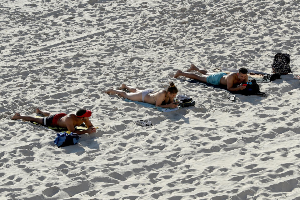 Members of the public are seen adhering to social distancing rules at Cottesloe Beach on April 6.