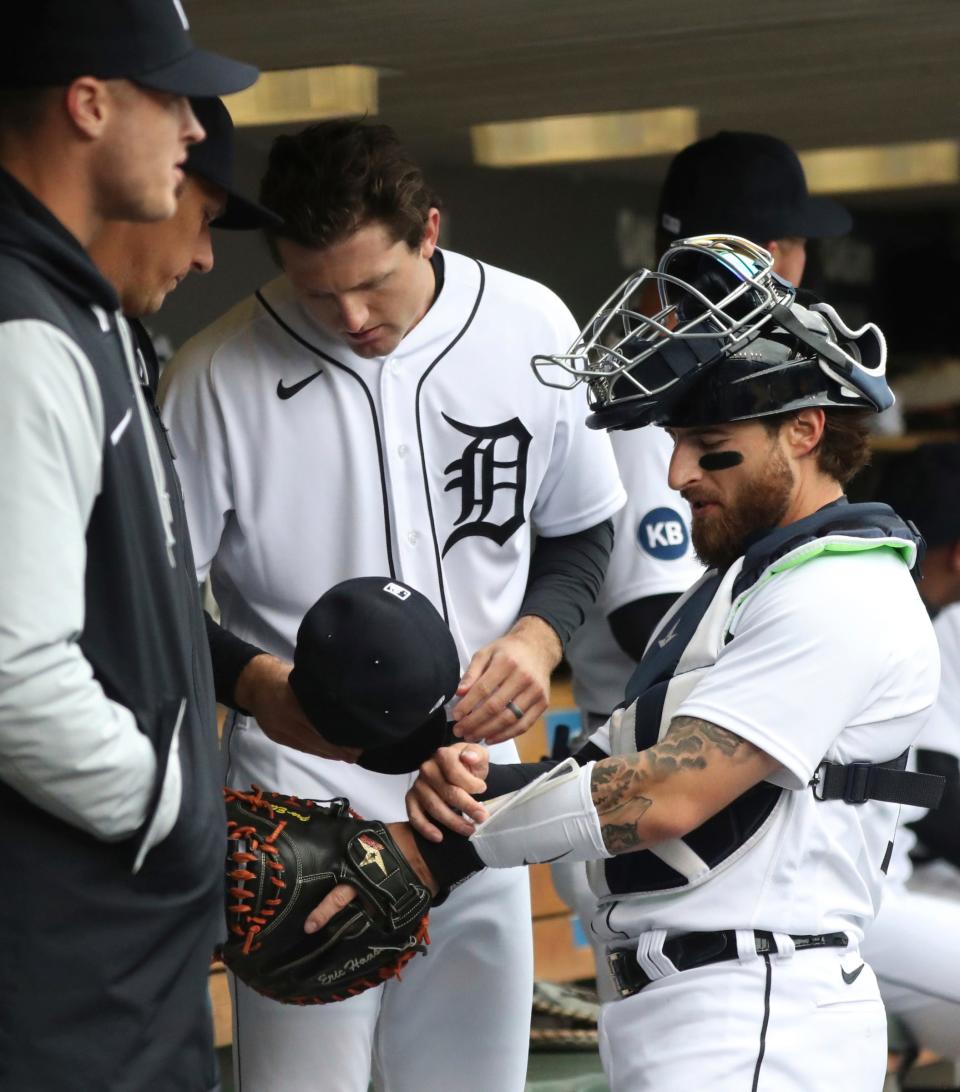Detroit Tigers starting pitcher Casey Mize, center, and catcher Eric Haase in the dugout before action against the Chicago White Sox, Saturday, April 9, 2022, at Comerica Park.