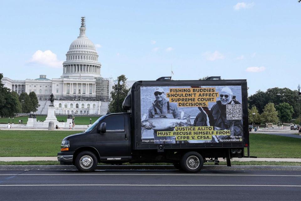 PHOTO: Government watchdog Accountable.US launches a campaign to call for recusals from Supreme Court Justices Samuel Alito and Clarence Thomas on the first day of The Supreme Court's 2023-2024 term on Capitol Hill, Oct. 2, 2023, in Washington, D.C. (Paul Morigi/Getty Images)