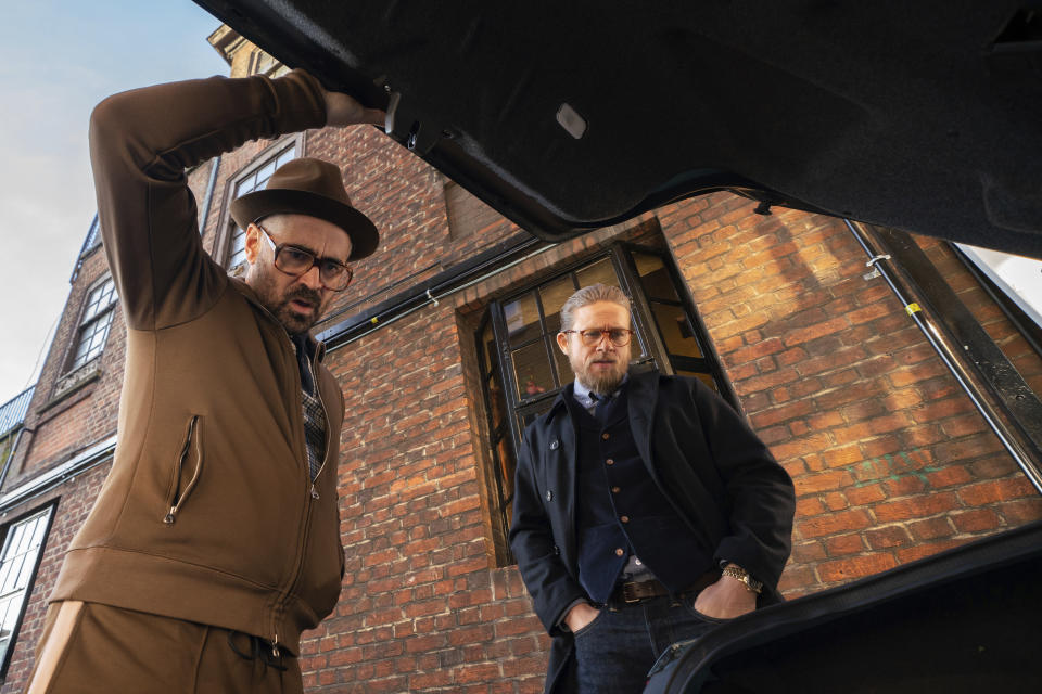 This image released by STXfilms shows Colin Farrell, left, and Charlie Hunnam in a scene from "The Gentlemen." (Christopher Raphael/STXfilms via AP)