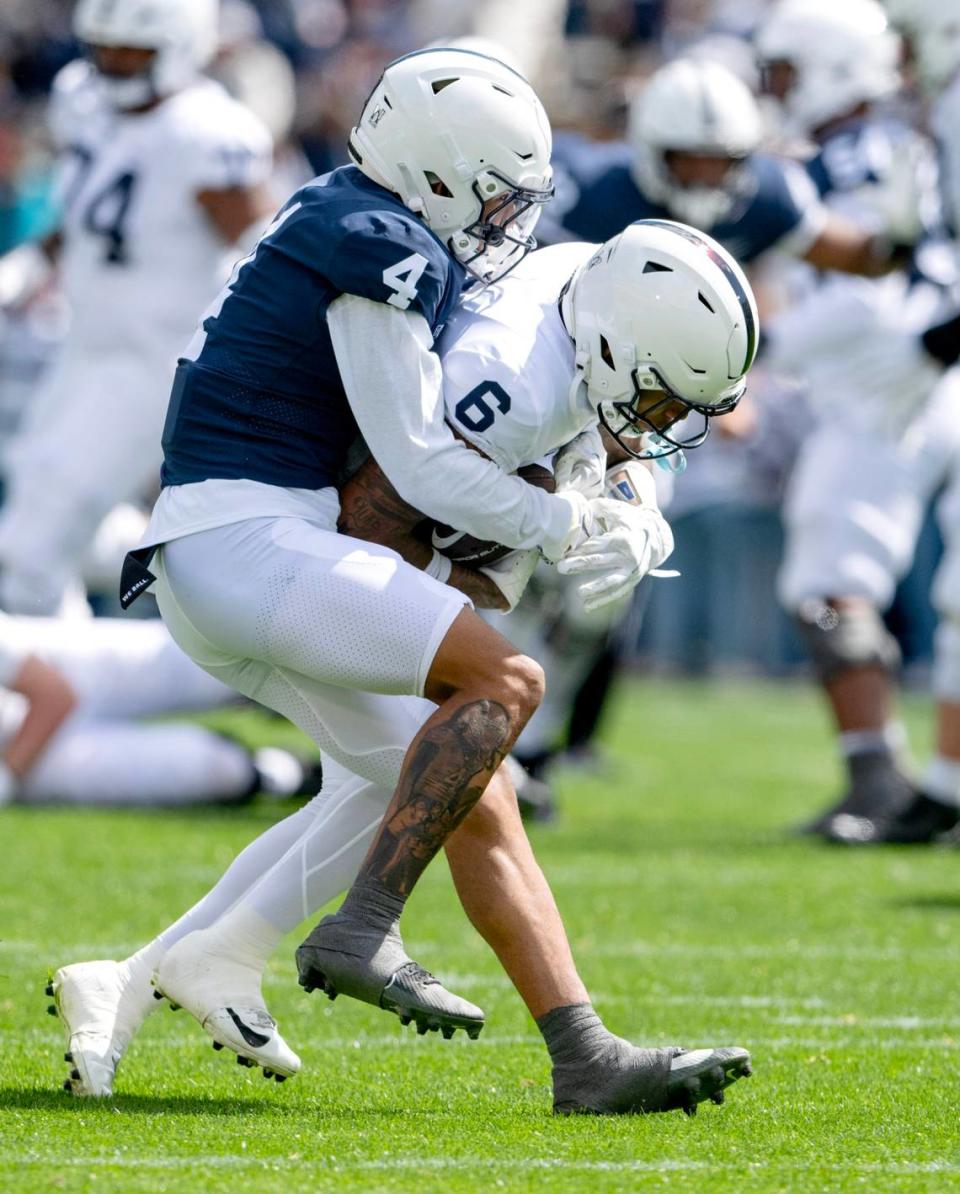 Penn State cornerback <a class="link " href="https://sports.yahoo.com/ncaaf/players/405650/" data-i13n="sec:content-canvas;subsec:anchor_text;elm:context_link" data-ylk="slk:A.J. Harris;sec:content-canvas;subsec:anchor_text;elm:context_link;itc:0">A.J. Harris</a> stops wide receiver Harrison Wallace III during the Blue-White game on Saturday, April 13, 2024. Abby Drey/adrey@centredaily.com