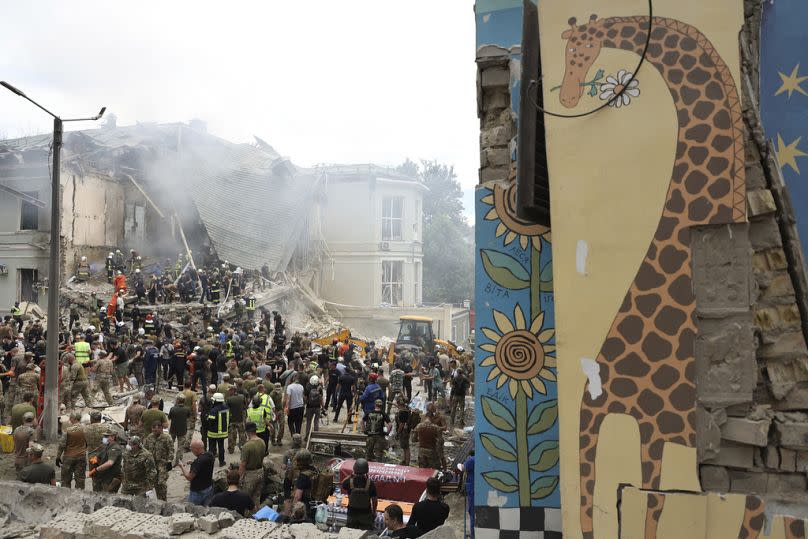 Rescuers, medical staff and volunteers clean up the rubble and search victims after Russian missile hit the country's main children hospital Okhmadit on Monday, July 8, 2024.