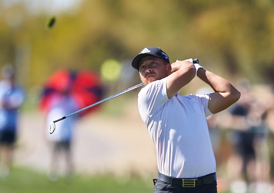 Feb. 12, 2022; Scottsdale Arizona, USA; Xander Schauffele watches a shot on hole 9 during Round 3 at the WM Phoenix Open. Mandatory Credit: Alex Gould - The Republic