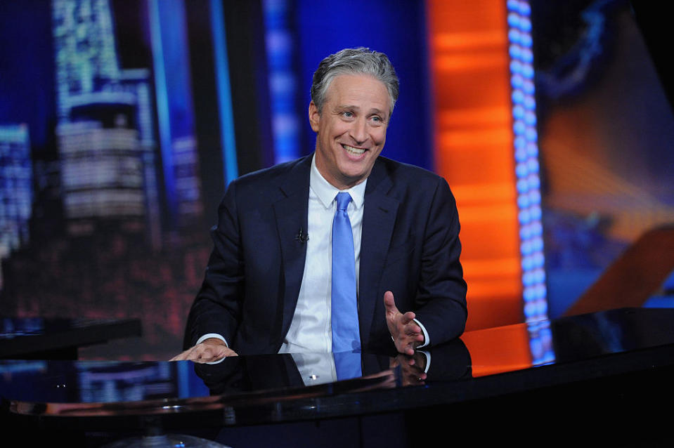 Jon Stewart smiling on set of the Daily Show