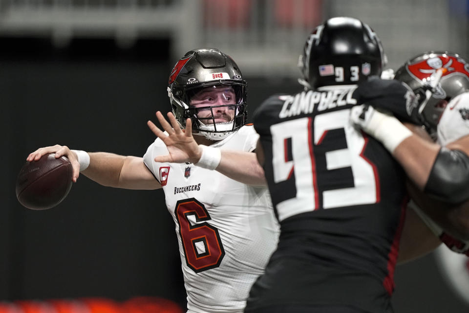 Tampa Bay Buccaneers quarterback Baker Mayfield (6) throws under presure from Atlanta Falcons defensive tackle Calais Campbell (93) during the second half of an NFL football game, Sunday, Dec. 10, 2023, in Atlanta. (AP Photo/Brynn Anderson)