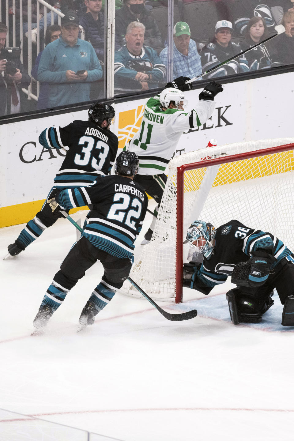 Dallas Stars center Logan Stankoven (11) celebrates a goal, in front of San Jose Sharks defenseman Calen Addison (33) and center Ryan Carpenter (22) during the third period of an NHL hockey game Tuesday, March 5, 2024, in San Jose, Calif. (AP Photo/Nic Coury)