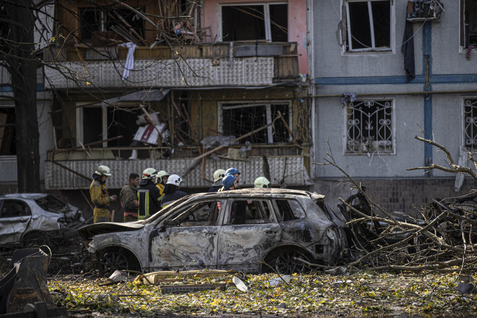 ZAPORIZHZHIA, UKRAINE - OCTOBER 09:Firefighters conduct work at a damaged building in a residential area after Russian attacks leaving 12 dead and 49 injured in Zaporizhzhia, Ukraine on Octobert 09, 2022. (Photo by Metin Aktas/Anadolu Agency via Getty Images)