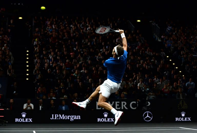 Swiss tennis player Roger Federer of Team Europe returns a ball to Sam Querrey (not in picture) of the United States and Team World during the second day of the Laver Cup on September 23, 2017 in Prague