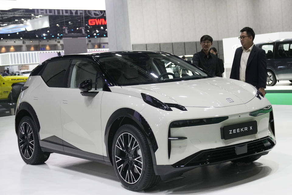 Visitors look at ZEEKR X during the 45th Bangkok Motor Show in Nonthaburi, Thailand, Tuesday, March 26, 2024. (AP Photo/Sakchai Lalit)