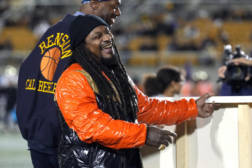 Oct 22, 2022; Berkeley, California, USA; California Golden Bears former running back Marshawn Lynch stands on the field before the start of the second quarter of the game between the California Golden Bears and the Washington Huskies at FTX Field at California Memorial Stadium. Mandatory Credit: Darren Yamashita-USA TODAY Sports