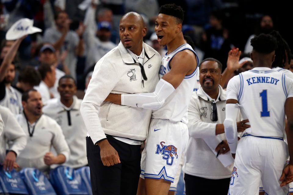 Memphis Tigers forward Kaodirichi Akobundu-Ehiogu (5) reacts with Memphis Tigers head coach Penny Hardaway (left) during the first half against the Mississippi Rebels at FedExForum.