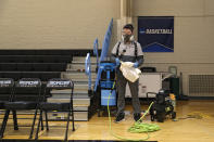 Taylor Michel, Director of Operations of DTG, Disinfecting Technologies Group, prepares to disinfect the arena following Yeshiva playing Worcester Polytechnic Institute in the NCAA Division III Men's Basketball Championship - First Round at Goldfarb Gymnasium on at Johns Hopkins University on March 6, 2020 in Baltimore, Maryland. On Thursday, Maryland Gov. Larry Hogan announced that Maryland had confirmed three cases of residents with COVID-19, otherwise known as the Coronavirus, prompting Johns Hopkins officials to host the NCAA men's basketball tournament without spectators. (Photo by Patrick Smith/Getty Images)