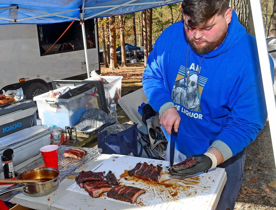 John Witt prepares to submit ribs on Nov. 13, 2022, during the Kansas City Barbeque Society World Invitational Championship at Noccalula Falls Park in Gadsden. Witt is part of the Shmack Q BBQ team from Chicago.