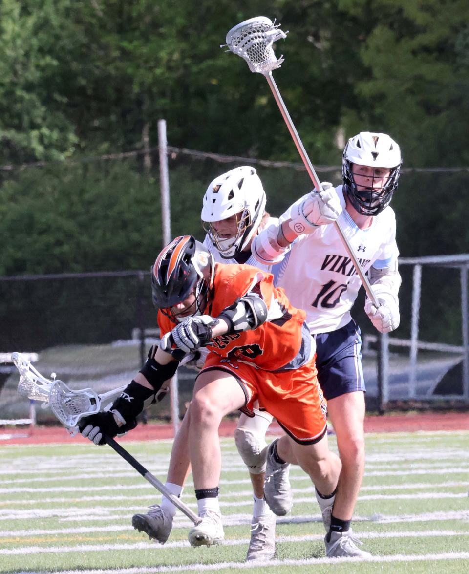 Middleboro's Kyle Jones, bottom goes after a loose ball during a game versus East Bridgewater on Tuesday, May 17, 2022.    