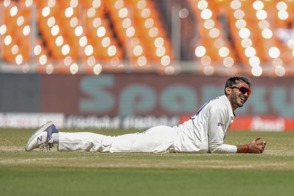 India's Axar Patel smiles after he attempted to stop a ball during the second day of the fourth cricket test match between India and Australia in Ahmedabad, India, Friday, March 10, 2023. (AP Photo/Ajit Solanki)