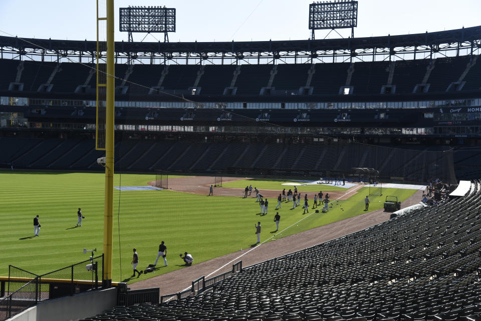 CHICAGO, ILLINOIS - JULY 22: The Chicago White Sox warmup in the outfield before the game against the Miami Marlins behind newly installed extended protective netting at Guaranteed Rate Field that runs from the ends of each dugout down to the foul poles on each side of the field of play, on July 22, 2019 in Chicago, Illinois. (Photo by David Banks/Getty Images)