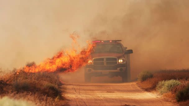 PHOTO: A Cal Fire fireman monitors the progress of the Danny Fire as it burns over 1,500 acres of Lancaster, California, June 4, 2023. (David Swanson/Reuters)