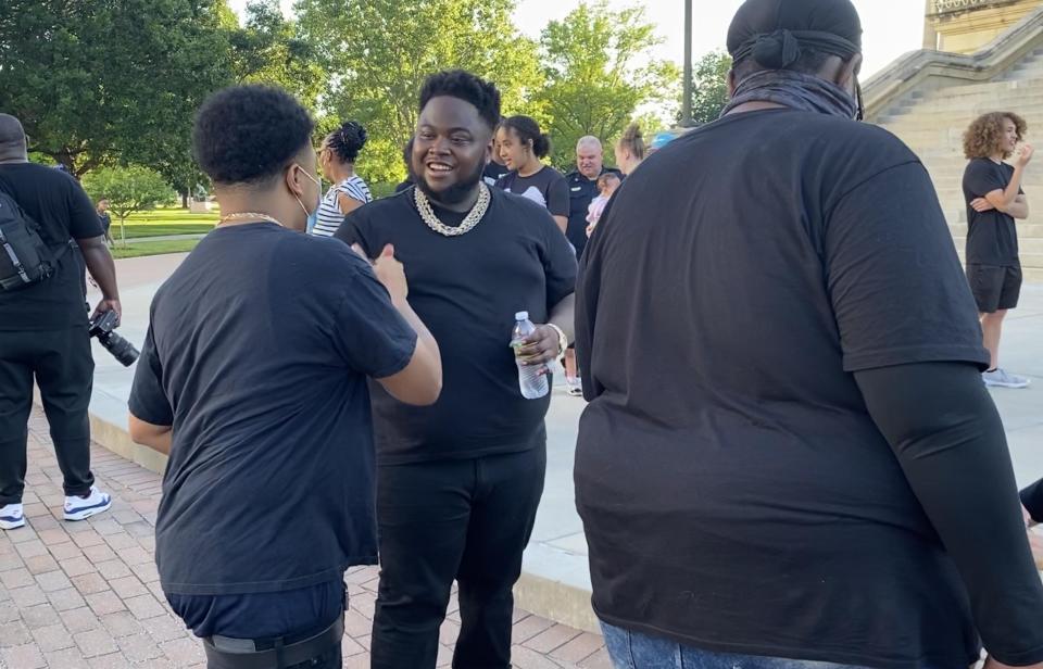 Music artist T-Rell prepares to shoot a video in 2020 with a mixture of youths and members of the Topeka Police Department.