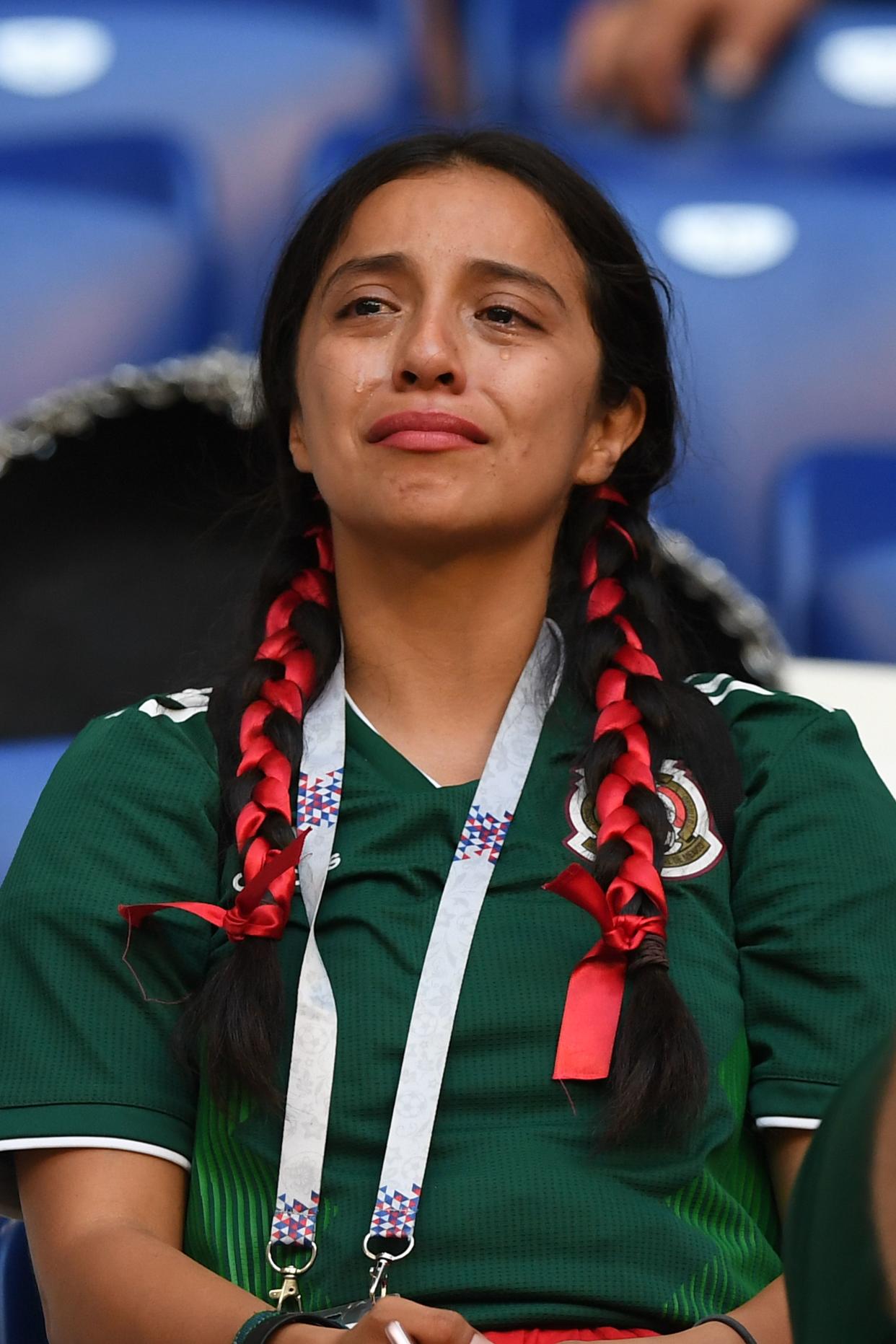 A Mexico's fan cries at the end of the Russia 2018 World Cup round of 16 football match between Brazil and Mexico at the Samara Arena in Samara on July 2, 2018. (Photo by MANAN VATSYAYANA / AFP) / RESTRICTED TO EDITORIAL USE - NO MOBILE PUSH ALERTS/DOWNLOADS        (Photo credit should read MANAN VATSYAYANA/AFP/Getty Images)