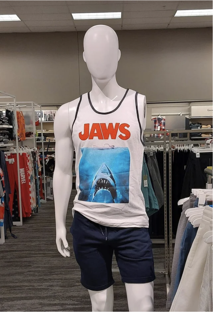 A mannequin missing an arm and wearing a "Jaws" shirt