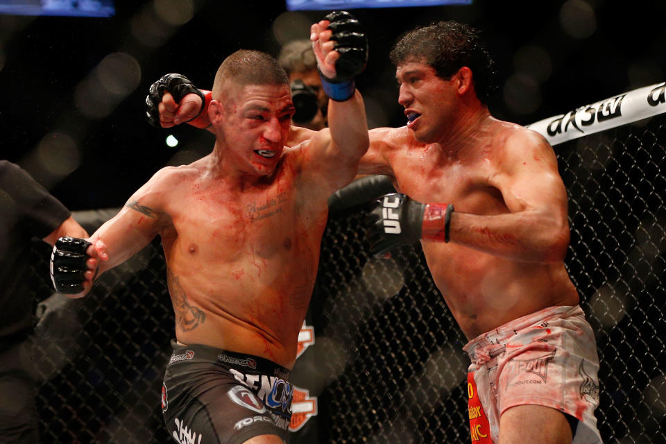 Despite what looked like a wild brawl with Diego Sanchez (L), Gilbert Melendez (R) said there was a lot of strategy in that fight. He said he’ll try to explain that strategy to viewers in his new ESPN show. (Getty Images)