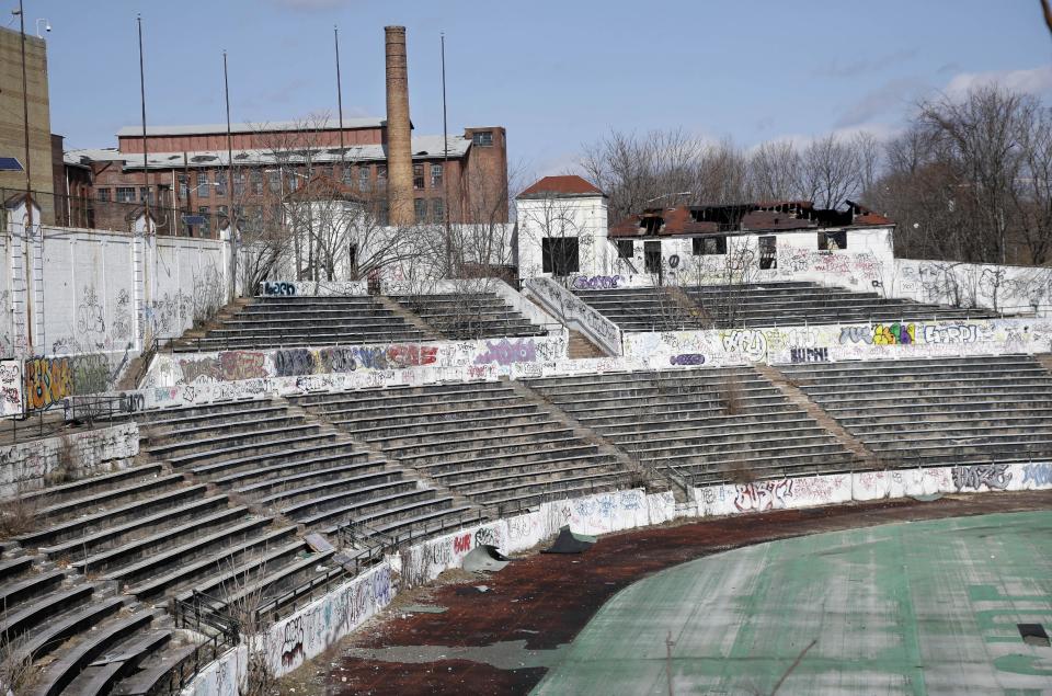 Graffiti covers the stands in Hinchliffe Stadium in Paterson, N.J. on Thursday, March 14, 2013. Built as a public works project municipal stadium in 1932, it now stands in disuse. The once-grand Art Deco stadium earned designation in March as a national landmark - less than two years after the nearby Great Falls, a powerful 77-foot waterfall that helped fuel the Industrial Revolution, became a national park. (AP Photo/Mel Evans)