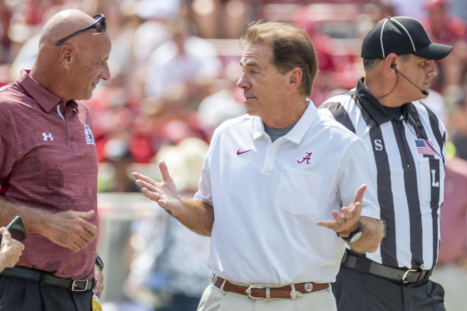 Alabama head coach Nick Saban chats with New Mexico State head coach Doug Martin before an NCAA college football game against New Mexico State, Saturday, Sept. 7, 2019, in Tuscaloosa, Ala. (AP Photo/Vasha Hunt)