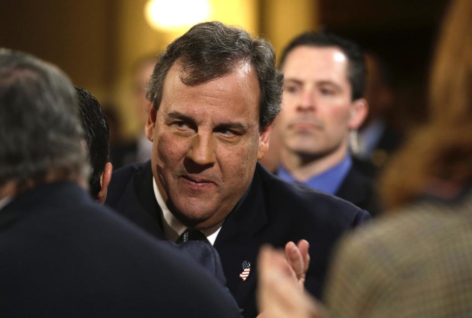 In this Tuesday, Jan. 14, 2014 file photo, New Jersey Gov. Chris Christie arrives to deliver his State Of The State address at the Statehouse in Trenton, N.J. Christie, eager to get on with business amid a scandal over traffic jams that appear to have manufactured by aides, is meeting Thursday morning, Jan. 16, 2014, with homeowners affected by Superstorm Sandy even as the Legislature prepares to issue new subpoenas as part of its investigation. (AP Photo/Julio Cortez, File)