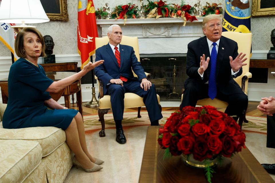 Vice President Mike Pence, center, looks on as House Minority Leader Rep. Nancy Pelosi, D-Calif., argues with President Donald Trump during a meeting in the Oval Office of the White House Dec. 11, 2018, in Washington.